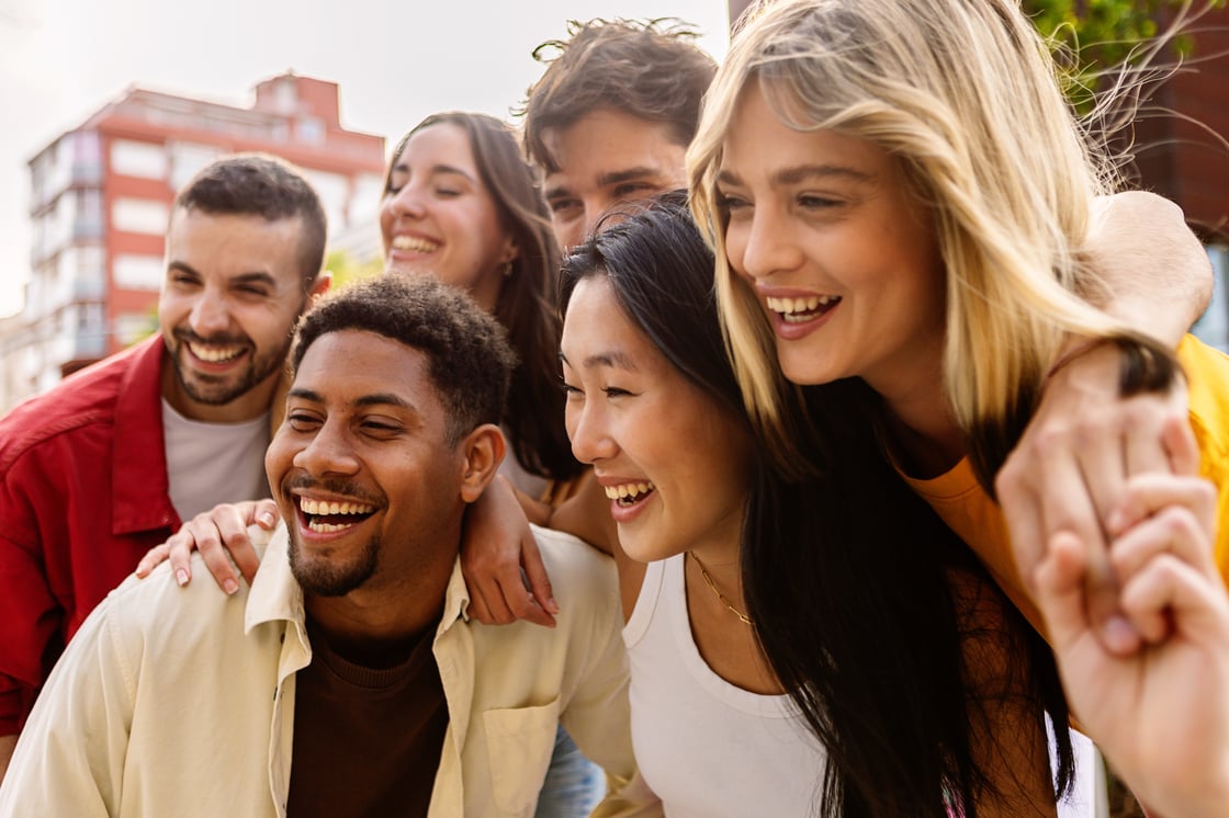 diverse students smiling and taking a photo