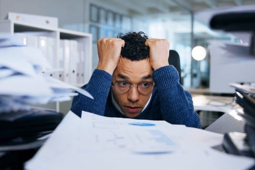 Business man, stress and paperwork in office for project deadline (resized)