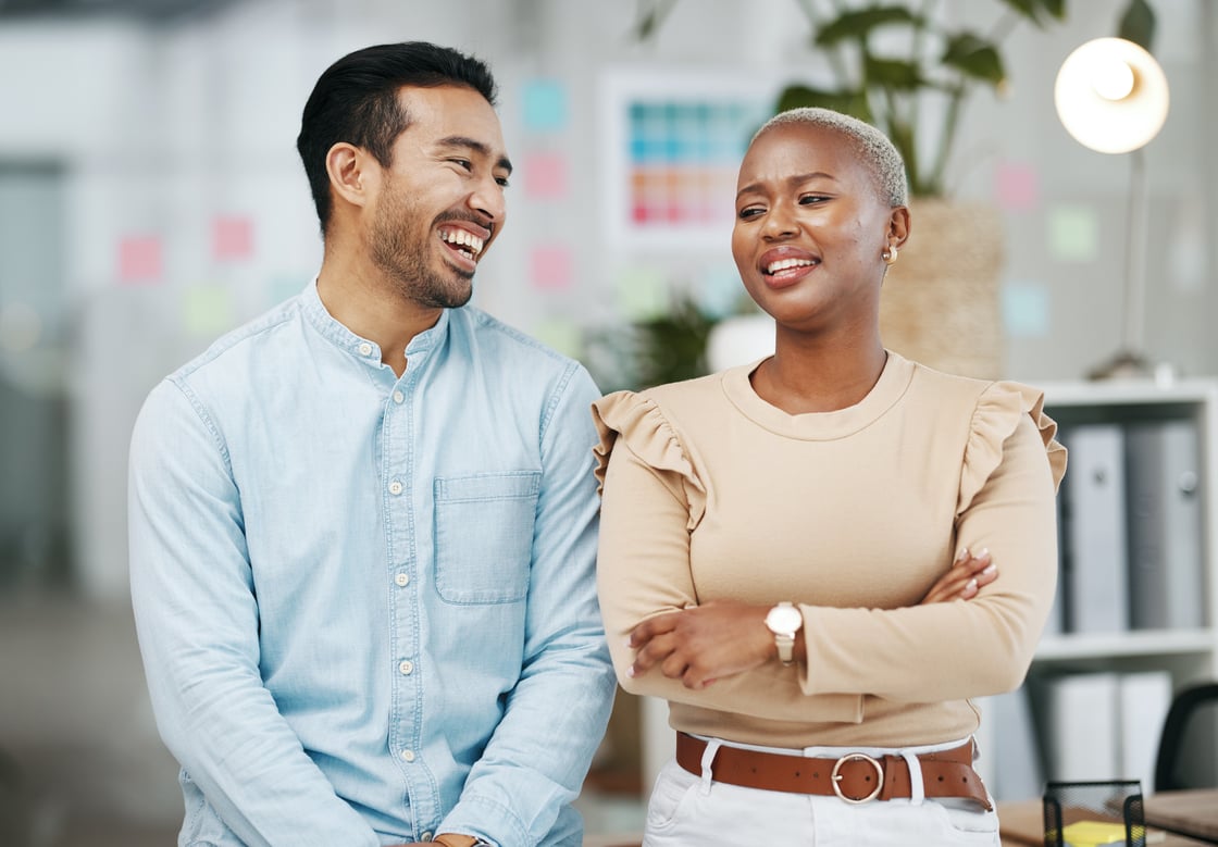 man and woman in office laughing-1