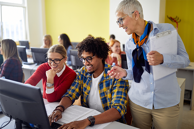 barbri_professor-working-with-students_article